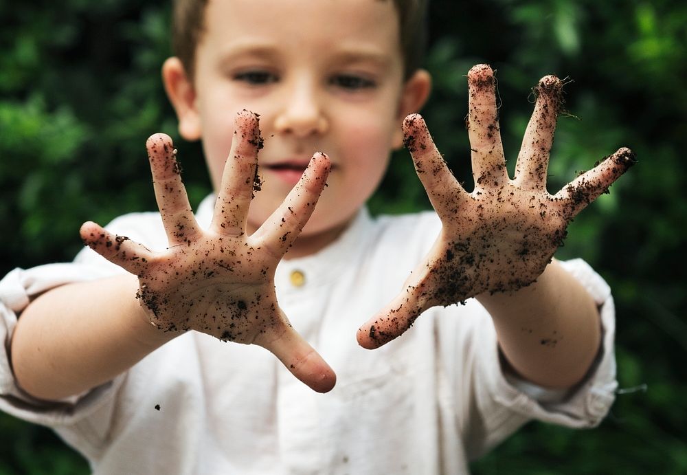 Young boy with dirty hands