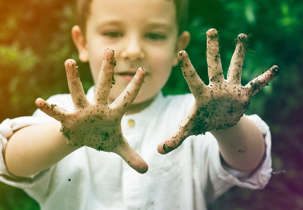 Cute little boy playing and get dirt childhood