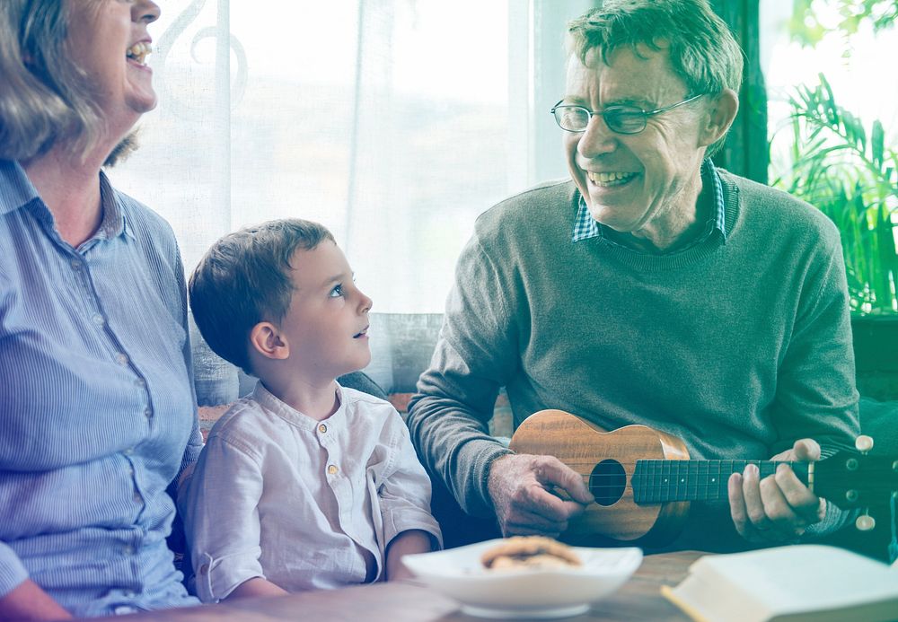 Happiness family playing leisure song with ukulele