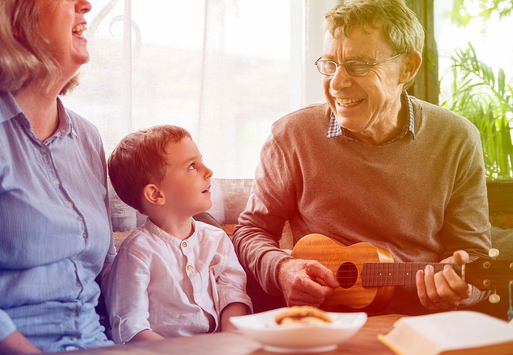 Happiness family playing leisure song with ukulele