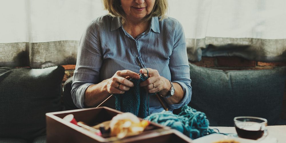Old caucasian woman knitting hobby