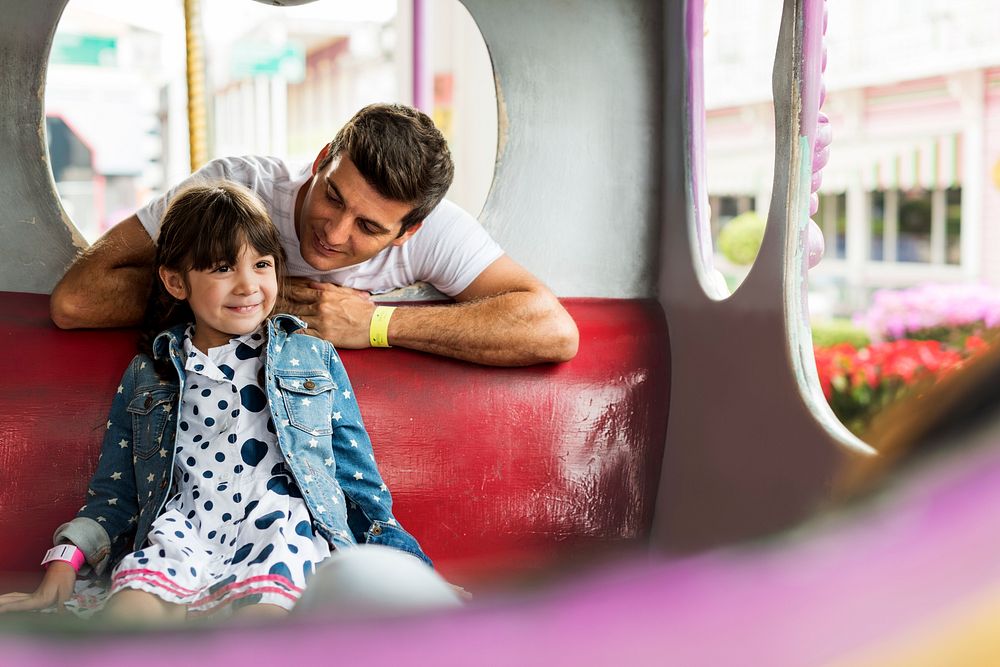 Dad and daughter at amusement park