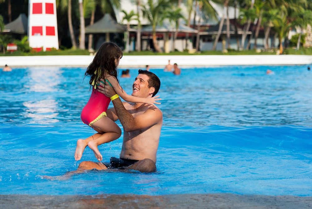 Family Swimming Pool Playing Togetherness Summer Holiday