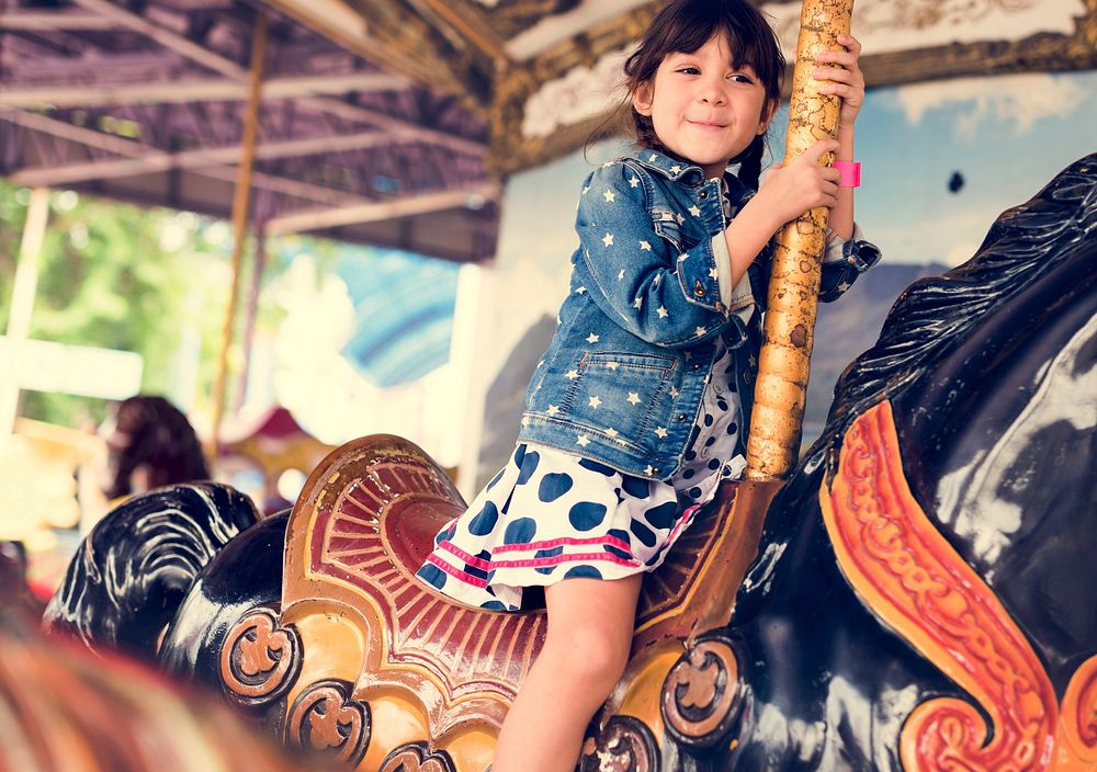 Little Girl Amusement Park Playful Merry Go Round