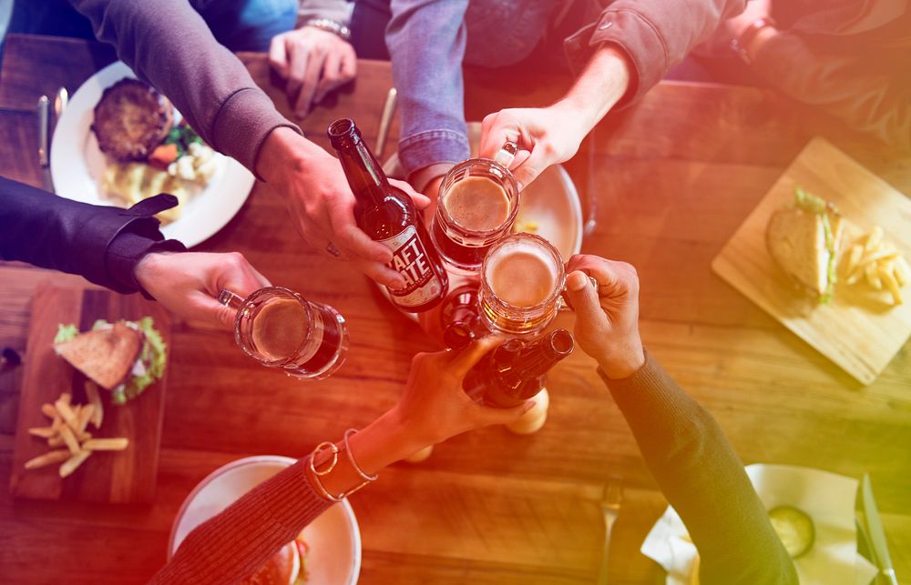 Group of people celebrate party with beer
