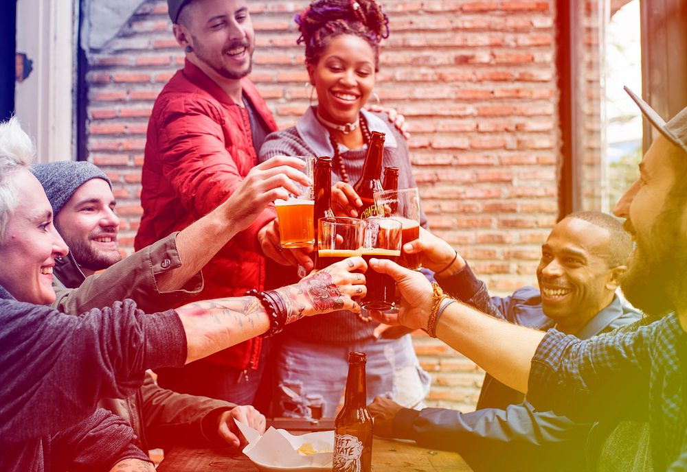 Group of people celebrate party with beer