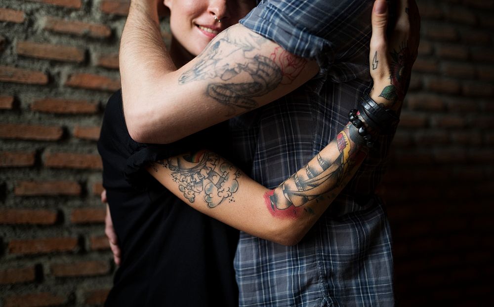 Tattoo Couple Embracing With Passion
