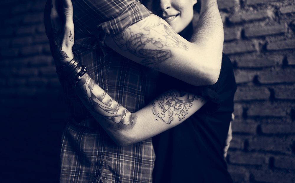 Tattoo Couple Embracing With Passion