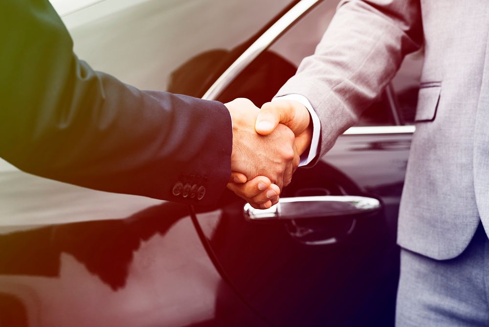 Businessmen greeting handshake deal with together