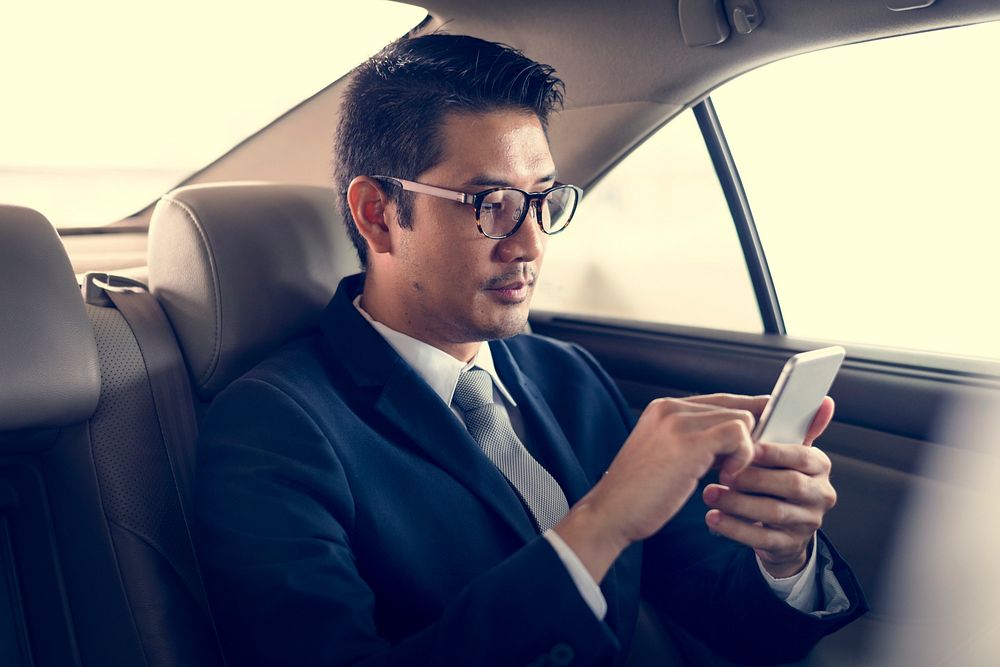 Businessman Sit Inside Car Use Mobile