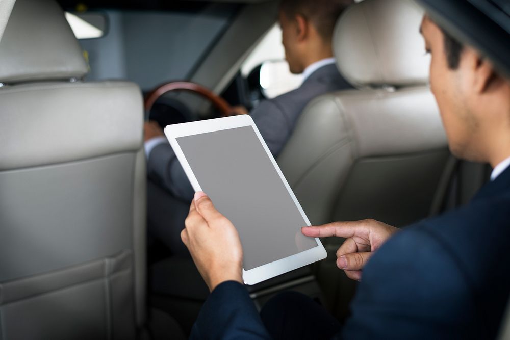 Businessman Use Tablet Inside Car