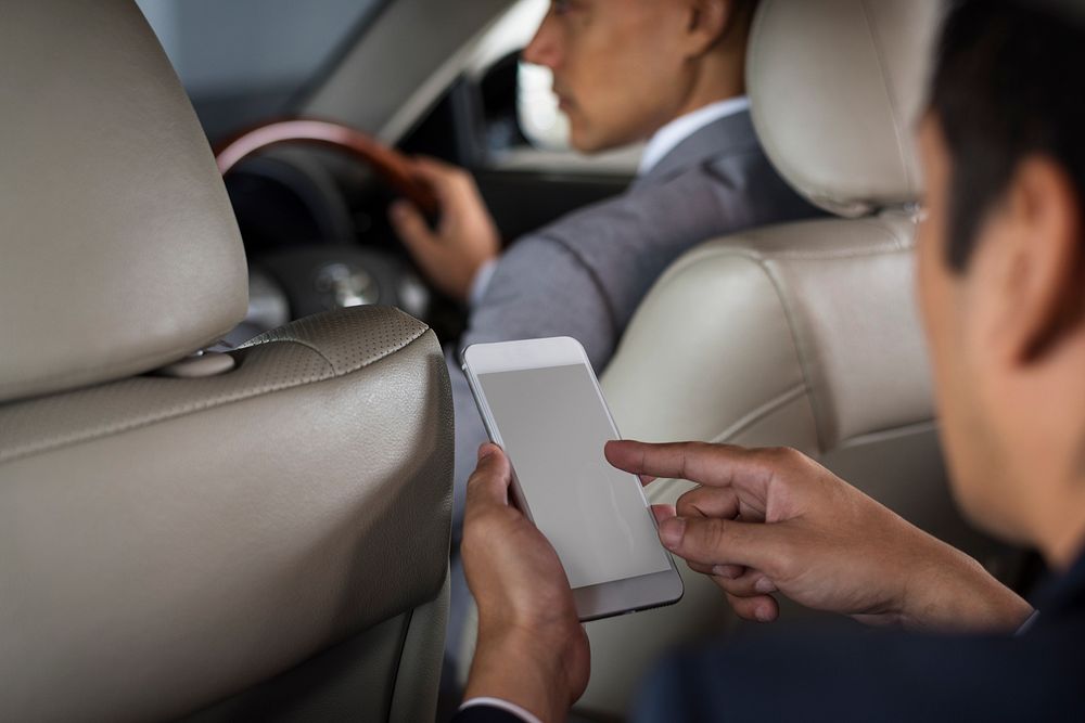 Businessman Use Mobile Inside Car