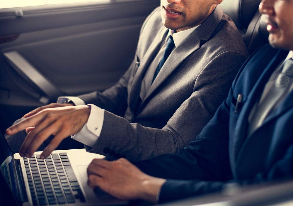 Business Men Use Laptop Car