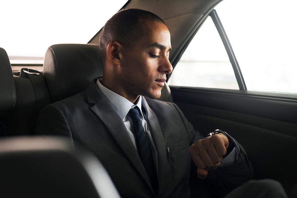 Businessman traveling alone by car