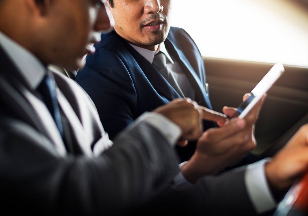 Businessman Use Mobile Inside Car