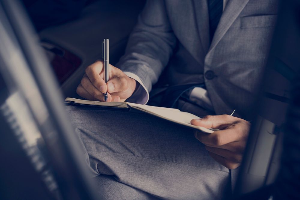 Businessman Hand Write Note Sit Car