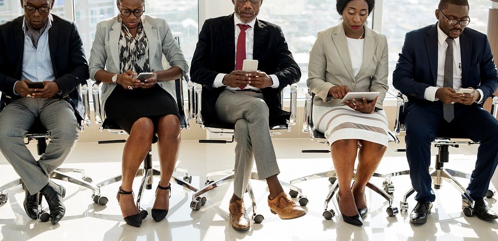 Diverse Business People Use Digital Devices