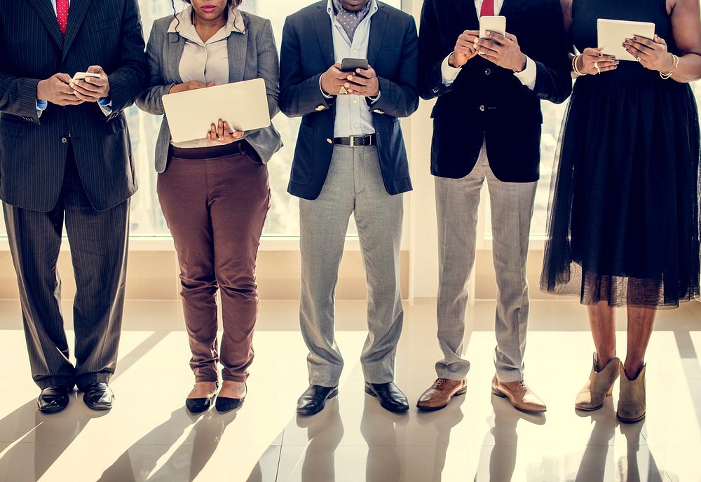 Diverse Business People Use Digital Devices