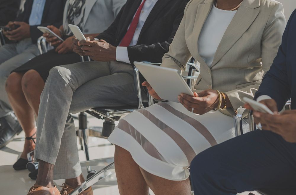 Diverse Business People Use Digital Devices