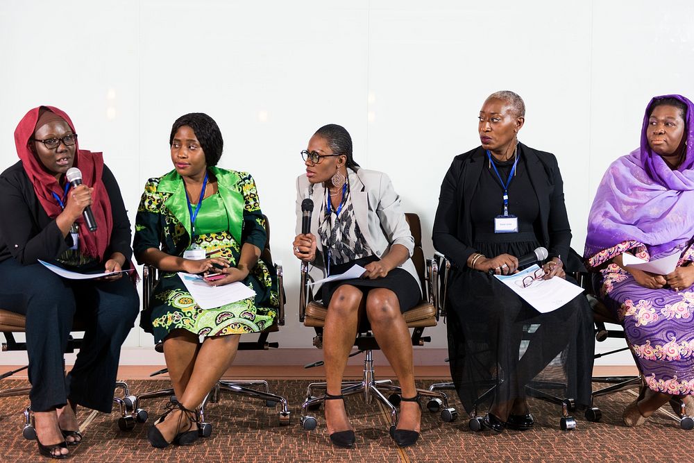 A Group of Business Women Participating in a Panel Discussion 
