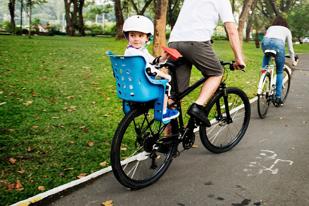 Family cycling together as a weekend activity