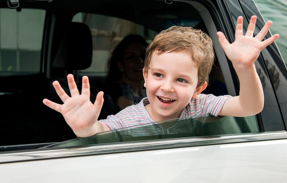 Boy Child in Car Cheerful Smiling Greeting