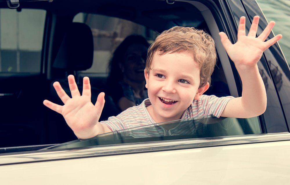 Boy Child in Car Cheerful Smiling Greeting