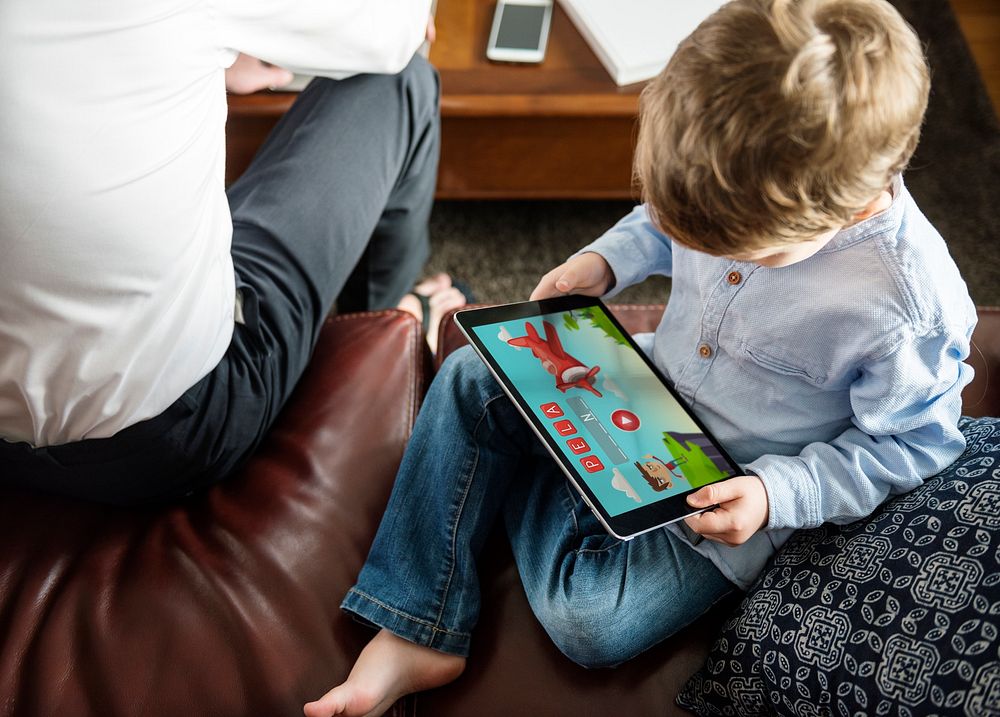 Son Using Tablet E-learning Game Education at Home