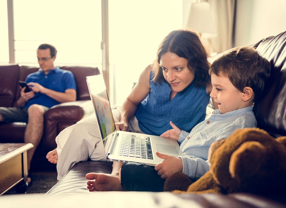Caucasian Family Spend Time Holiday Together Using Laptop Relax