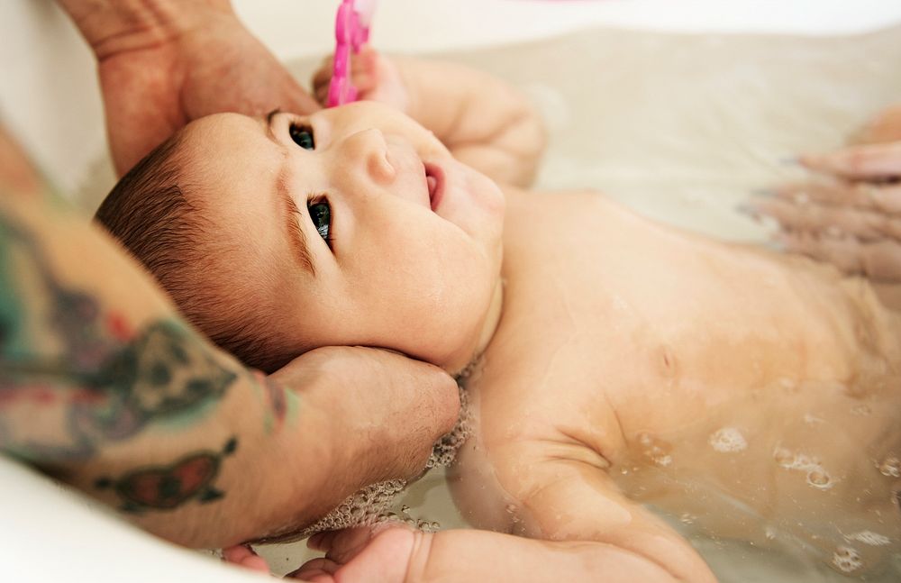 Closeup of baby taking a bath in the tub