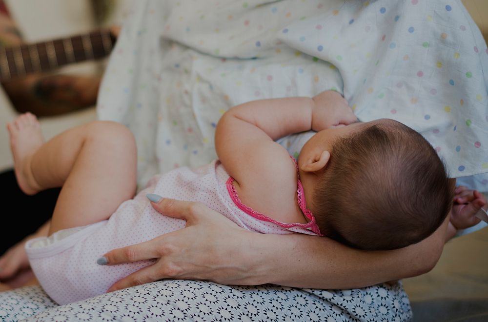 Mother Suckling Feeding Her Baby Newborn