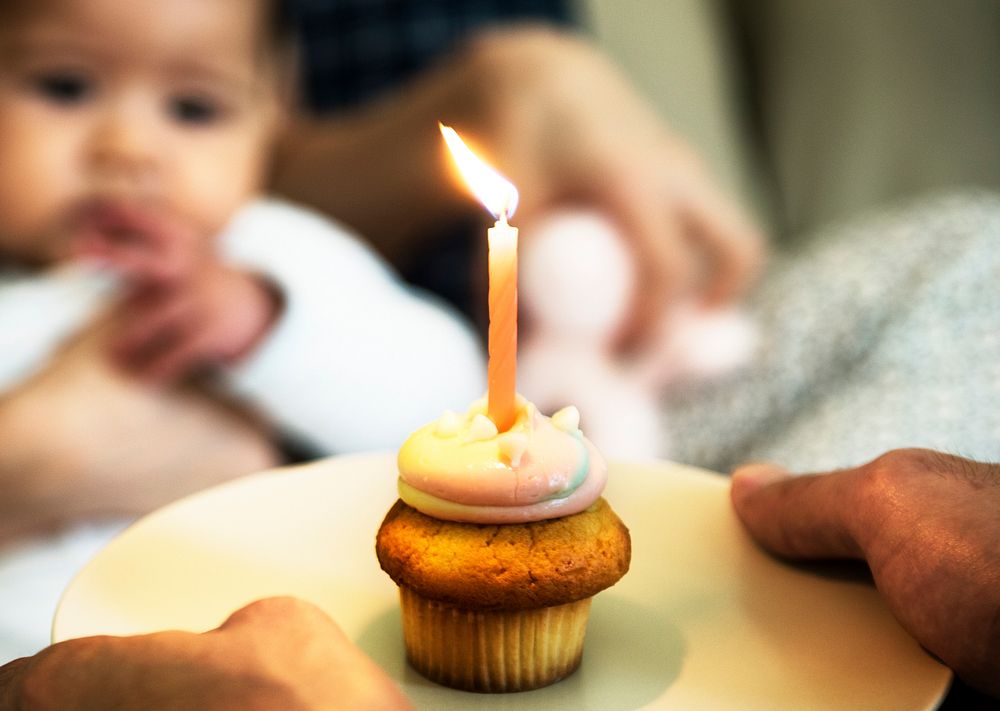 Muffin cake and candle for birthday celebration.