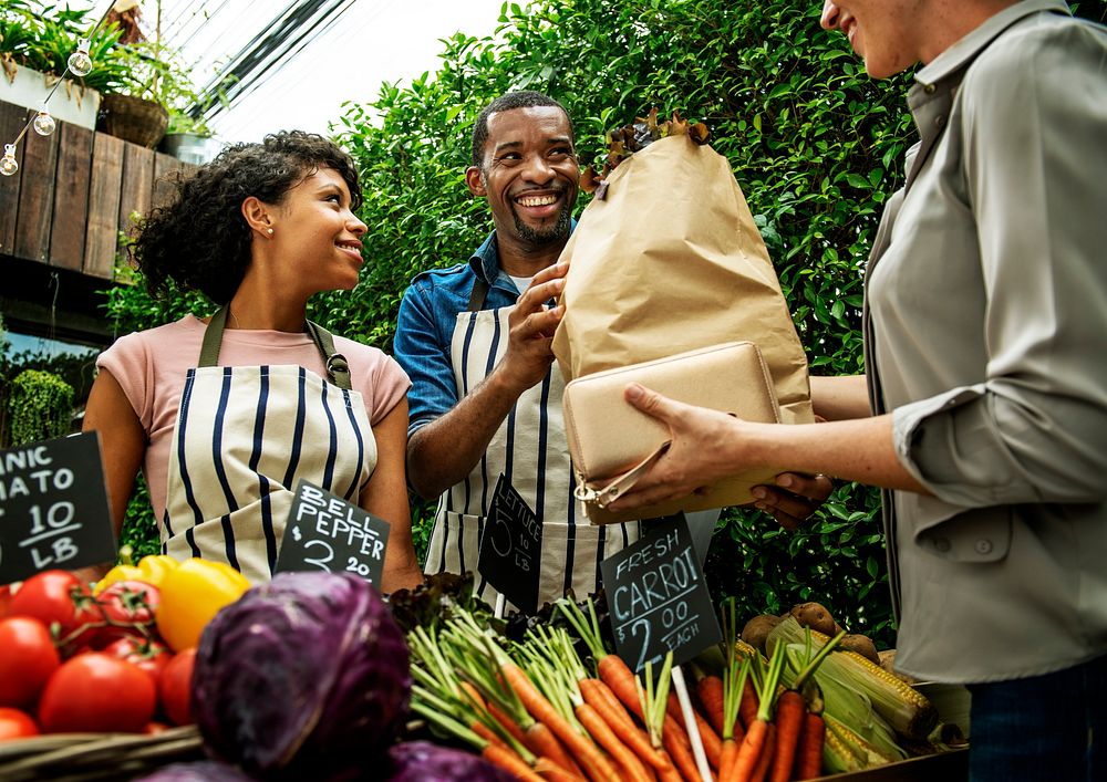 People Buying Vegetable From Shop at Market