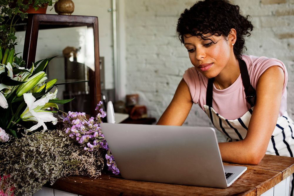 Woman Using Laptop Online Flower Shop