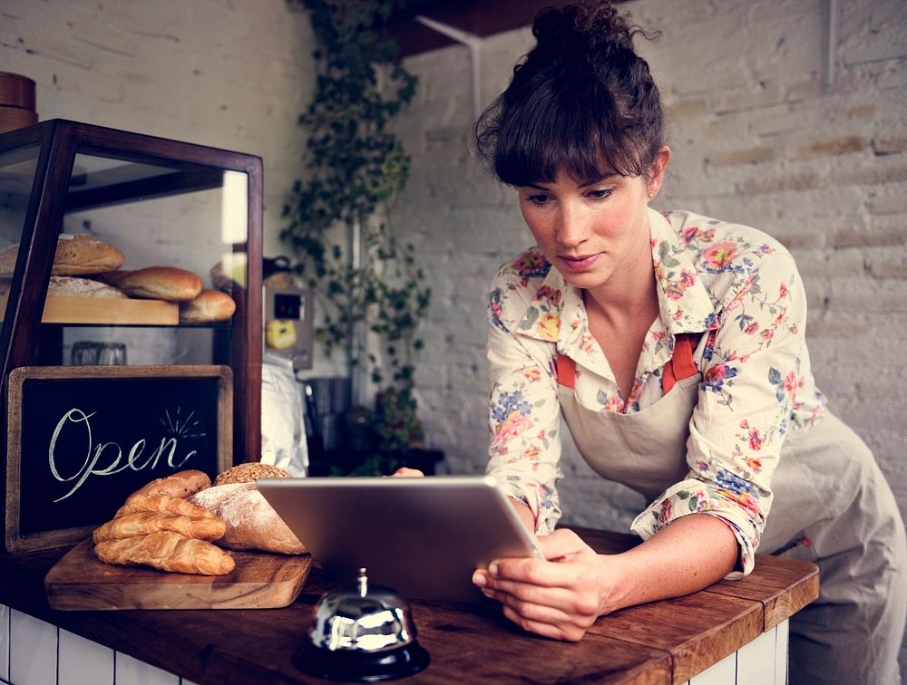 Woman using tablet for online business order