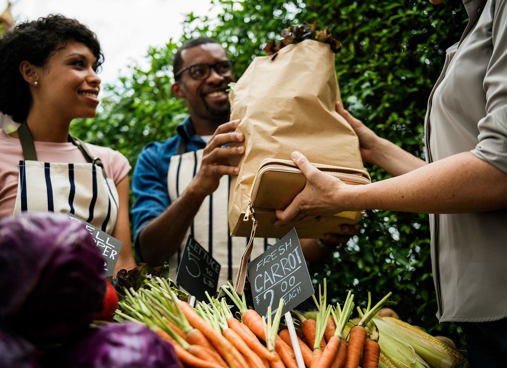 People Buying Vegetable From Shop at Market