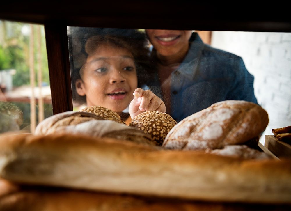 Customers choosing bread in the baker's house