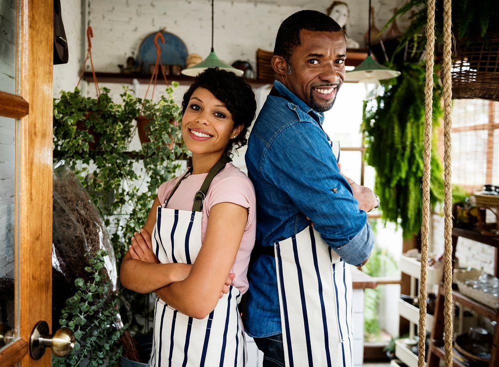 African Descent Owner Couple Stand Inside Flower Shop