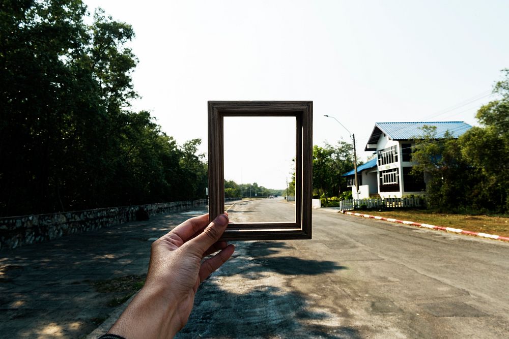 Hands holding an empty frame border