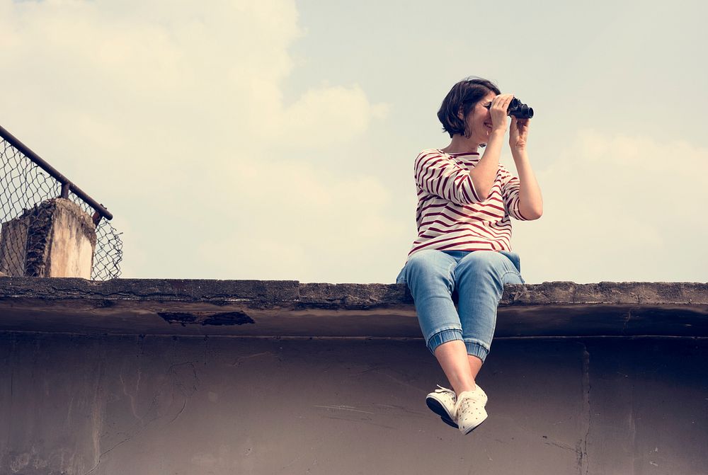Woman using binocular explore searching