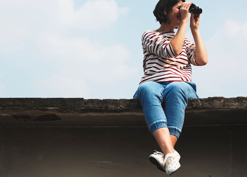 An Adult Woman Using Binocular and Looking at the Sky