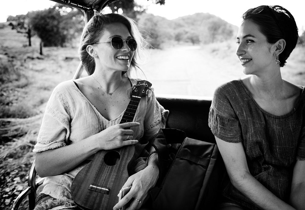 Girlfriends on the road trip to the nature