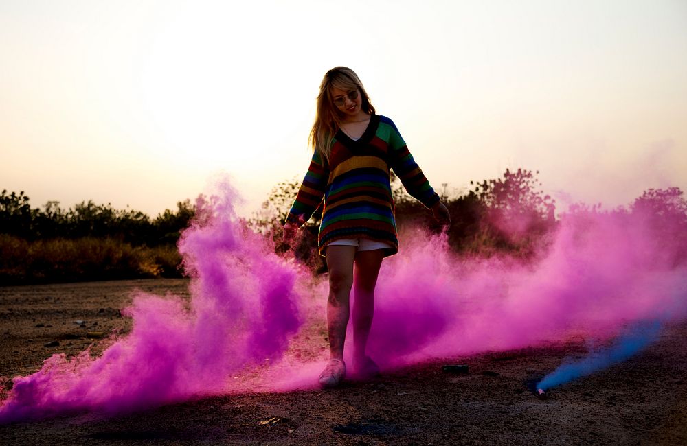 Woman Hands Holding Pink Smoke Bomb Outdoors