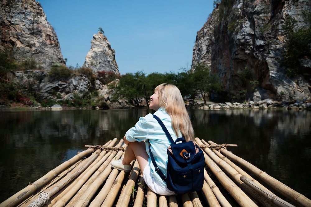 Young woman traveling on a raft