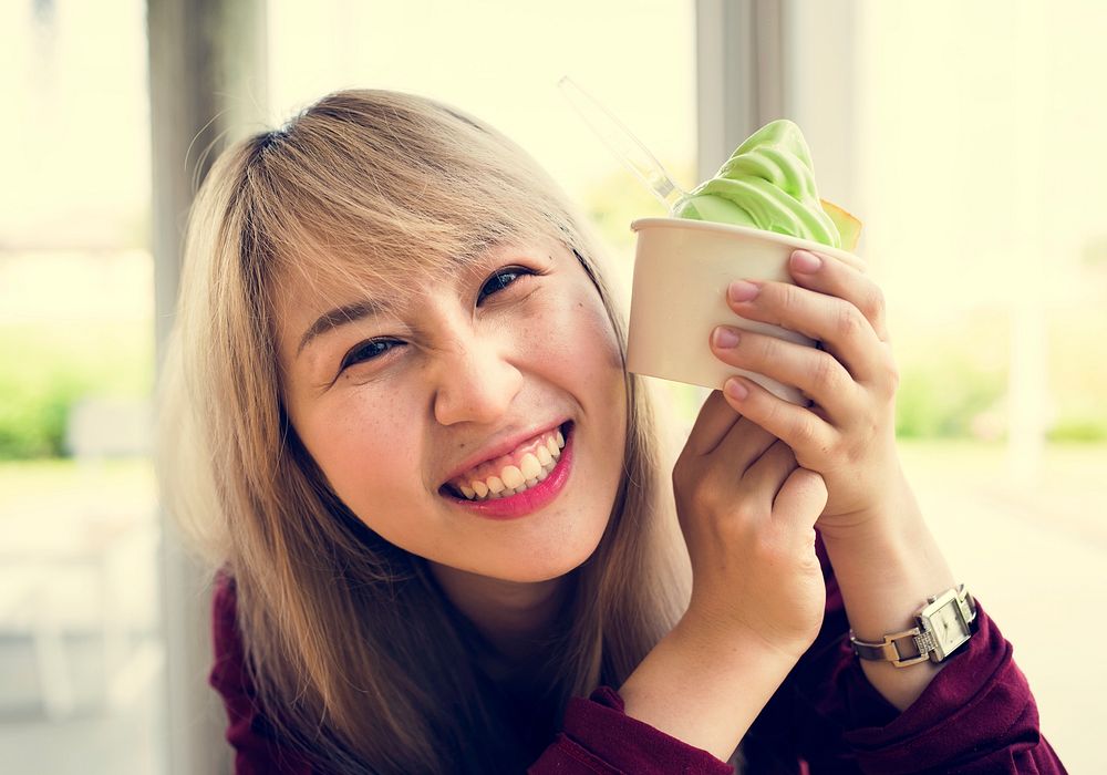 Woman eating melon ice-cream happiness