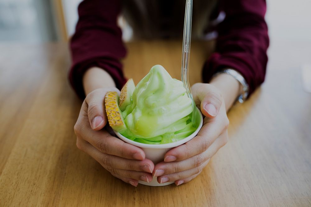 Closeup of green gelato in a cup