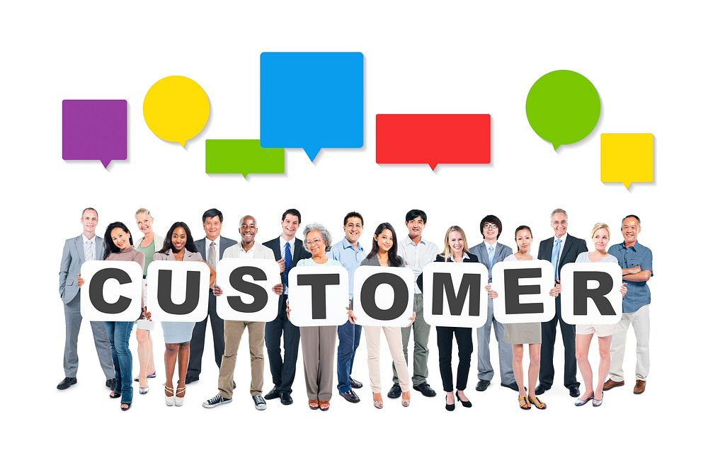Multi-Ethnic Group Of Business And Casual People Holding Cardboards Forming Customer And Related Symbols Above