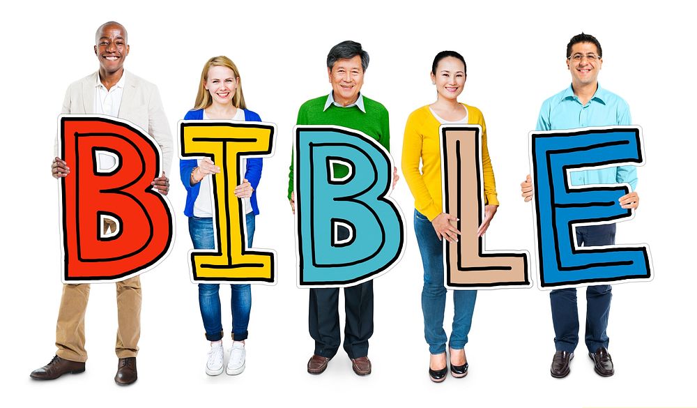 Multiethnic Group of People Holding Letter Bible
