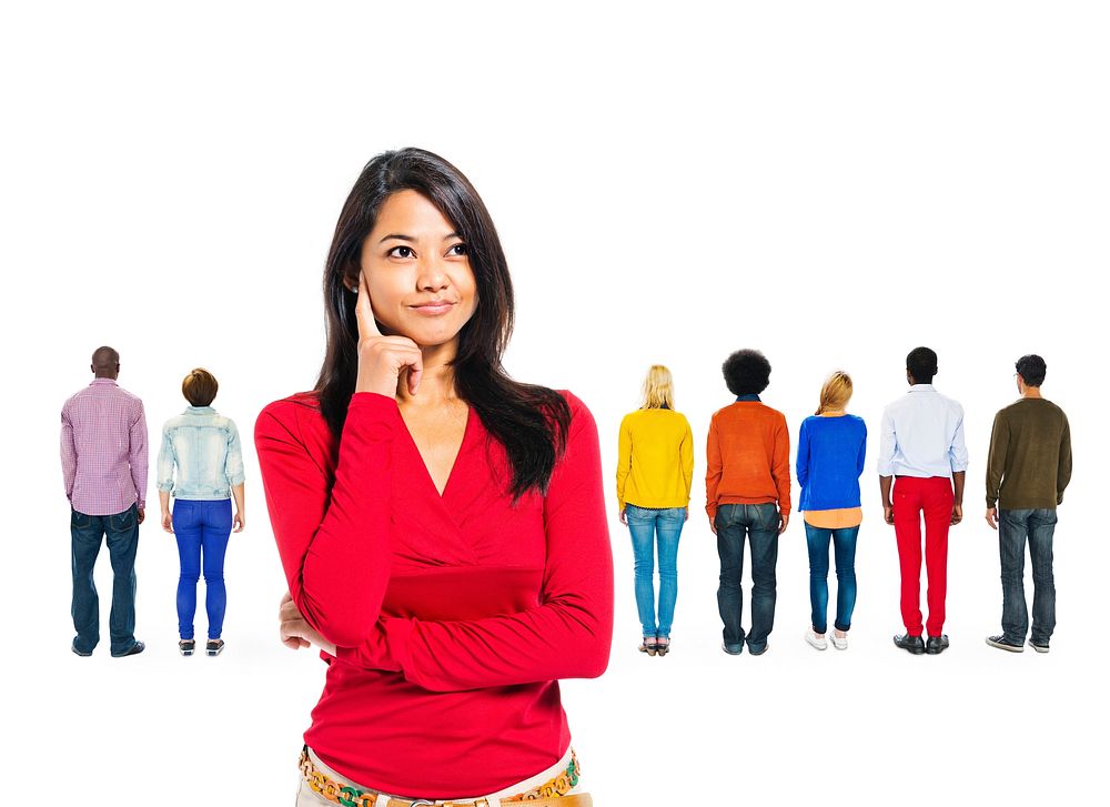 Woman thinking with diverse people behind her