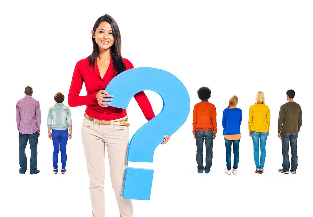 Back View Of multi-Ethnic People And A Young Woman Holding Question Mark